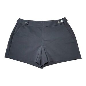 ELLE, BLACK POLISHED SHORTS WITH SILVER BUTTON DETAIL AT WAIST. SIZE 8